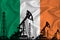 Developing Flag of Ireland. Silhouette of drilling rigs and oil rigs on a flag background. Oil and gas industry. The concept of