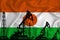 Developing Flag of Niger. Silhouette of drilling rigs and oil rigs on a flag background. Oil and gas industry. The concept of oil