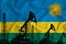 Developing Flag of Rwanda. Silhouette of drilling rigs and oil rigs on a flag background. Oil and gas industry. The concept of oil