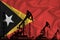 Developing Flag of timor. Silhouette of drilling rigs and oil rigs on a flag background. Oil and gas industry. The concept of oil