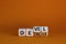 Devil in the details symbol. Turned cubes and changed the word `details` to `devil`. Beautiful orange background. Business and