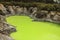 Devil`s Bath, a green sulphur lake at Waotaipu Thermal Wonderland in New Zealand.