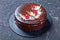 Devil`s chocolate cake with cherries on top