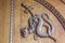 Devil snake symbol. Fantasy magic creature on an old door, 12th Century Abbey in Italy
