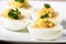 Deviled eggs garnished with parsley and paprika