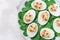 Deviled eggs stuffed with avocado, egg yolk and mayonnaise filling