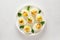 Deviled stuffed eggs with egg yolk, bacon, mustard and parsley