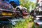 Devizes Wiltshire May 22nd 2019 A path through 2 rows of stacked car bodies in a breakers yard