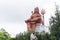 devotee praying to the hindu god lord shiva huge isolated statue at morning