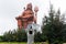 devotee praying to the hindu god lord shiva huge isolated statue at morning