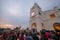 Devotees attend with white candle during last day of St Anne feast.