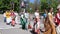 Devotees from Hare Krishna dancing with carnival revelers during the Vaishnava religious festival, dancing women in sari