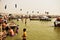 devotees taking bath at confluence of prayagraj