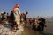 Devotees taking holy dip in the river Ganges during the Kumbh Mela