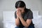 Devout African woman prays in morning sitting on bed