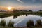 A Dew Pond on Ditchling Beacon at Sunset