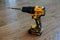 DeWalt cordless Power Drill on a wooden floor of new house