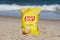 Dewey Beach, Delaware, U.S - August 13, 2022 - A bag of Lay\\\'s potato chips on the beach