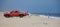 Dewey Beach, Delaware, U.S.A - September 21, 2021 - A red truck with a man surf fishing on a sunny day