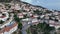 Dhermi at sunset time. Aerial shot of beautiful village sea view, stone houses, beach resort in mountains of Albania