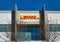 DHL business facade with sign logo and office storefront in Houston TX.