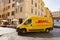 DHL delivery van in Rome streets , Italy, summer sunny morning