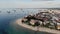 Dhow boats and Stone Town city at Unguja Zanzibar island in Tanzania. Indian ocean aerial view.