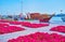 The dhow boats and yachts behind flower beds of Creek Side Park, Deira, Dubai, UAE