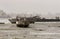 Dhow, fishing boat lying on sea bed in low tide