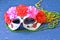 Dia de los muertos mask on a wooden background. Halloween carnival accessories. Day of the dead Masquerade holiday