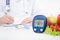 Diabetes at the doctor. Glucometer and vegetables concept