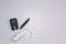 Diabetes equipment, glucose level blood test on blue background with copy space. Diabetic items to control diabetes