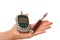 Diabetes hand with insulin syringe glucometer