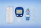 Diabetic kit: glucometer, test strips, lancet, metformin tablets.