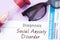 Diagnosis of Social Anxiety Disorder. Hourglass, doctor glasses, mental status exam are near inscription Social Anxiety Disorder.