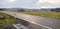 Diagonal asphalt road during early sunset in germany