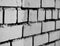 Diagonal black and white brick wall background