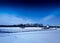 Diagonal hinged bridge over frozen river landscape background