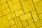 Diagonal pavement pattern toned in bright yellow