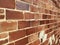 Diagonal perspective view old vintage red brick wall exterior structure interior design architectural background