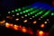 Diagonal RGB gaming keyboard bokeh background. Colorful mechanical keyboard in dark room. Gaming and technology concept