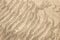 Diagonal rippled beach sand texture