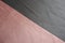 Diagonal seam between pink and grey artificial suede