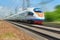 Diagonal view on high speed train runs on rail way tracks with motion blur effect background. Russian railways electric high speed