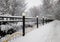 Diagonal winter park fence city background