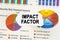 On diagrams and graphs lies torn paper with the inscription - IMPACT FACTOR