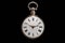 Dial of silver antique pocket watch on isolated black background. Old mechanical clock. Round retro pocketwatch with