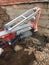 Diamond drilling machine hole in the concrete. a driller drills a hole in the concrete Foundation of a building