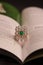 Diamond ring with green stone creative photography