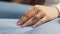 Diamond ring on the hand of a young woman, close-up